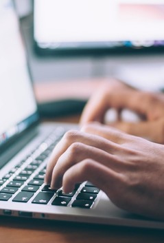 A stock photo of someone working on a computer