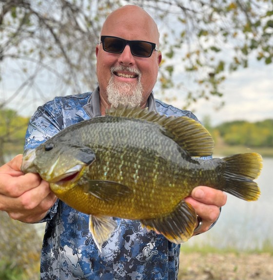 Ardoff holds the record sunfish up to the camera