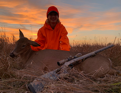 photo of hunter with his harvested deer