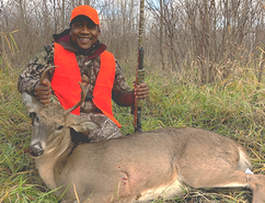 hunter with deer he harvested