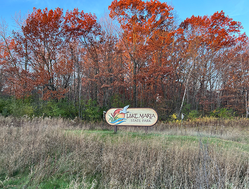 Lake Maria State Park sign with fall leaves