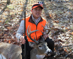 hunter with deer he harvested