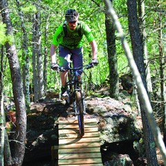 A person riding a mountain bike on a trail