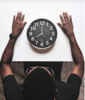 person looking at clock