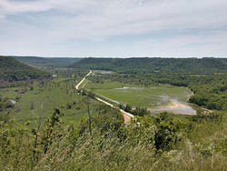 Whitewater WMA photo taken from a bluff looking down at the road that goes through the valley