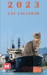 Enlarged cat sitting on front portion of ship