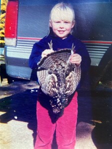 Young Hayley holding a grouse