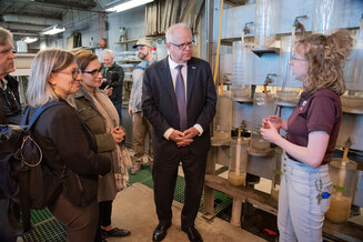 Gov. Tim Walz, Lt. Gov Peggy Flanagan, DNR Commissioner Sarah Strommen talk with DNR staff