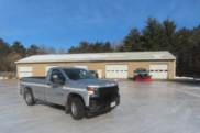 Fort Snelling State Park shop parking lot turned to Ice Rink after Winter rainstorm.