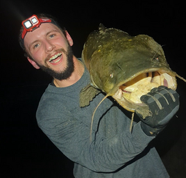 angler holding a large catfish