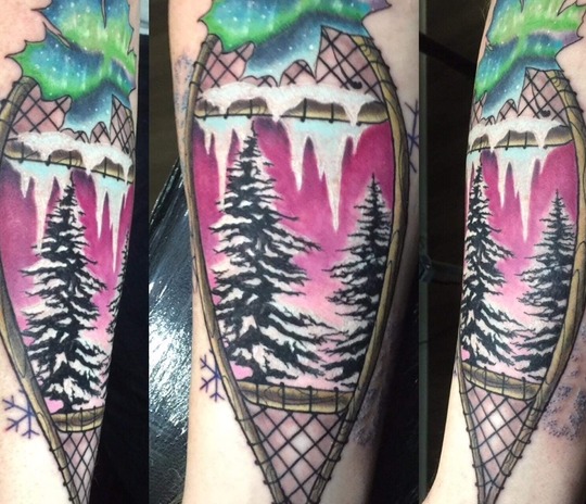 A composite of different angles of a tattoo of a snowshoe with trees and a leaf with northern lights