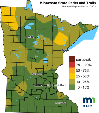 Map of the state of Minnesota with sections in yellow and different shades of green denoting fall color change in different regions.