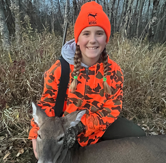 youth deer hunter with a doe she harvested 