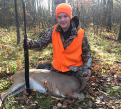 youth deer hunter with a doe he harvested