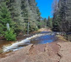 A flooded culvert and road