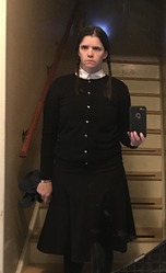 A woman dressed up as Wednesday from The Aadams family