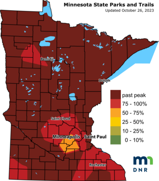 Map of the state of Minnesota with different areas in shades of red and yellow denoting fall color changes.