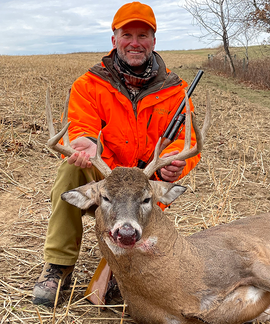 hunter with a deer he harvested