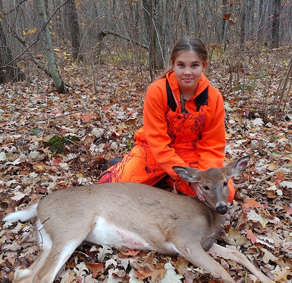 girl with a doe she harvested