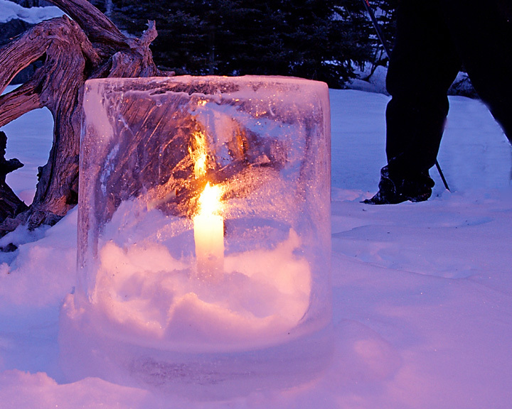 Ice candle in snow