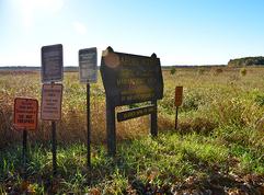 sunny signs at entrance to Carlos Avery WMA