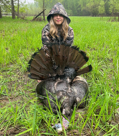 turkey hunter with a turkey harvested