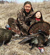 youth hunter and dad with harvested turkey