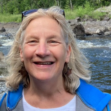Molly MacGregor standing by the St Louis River