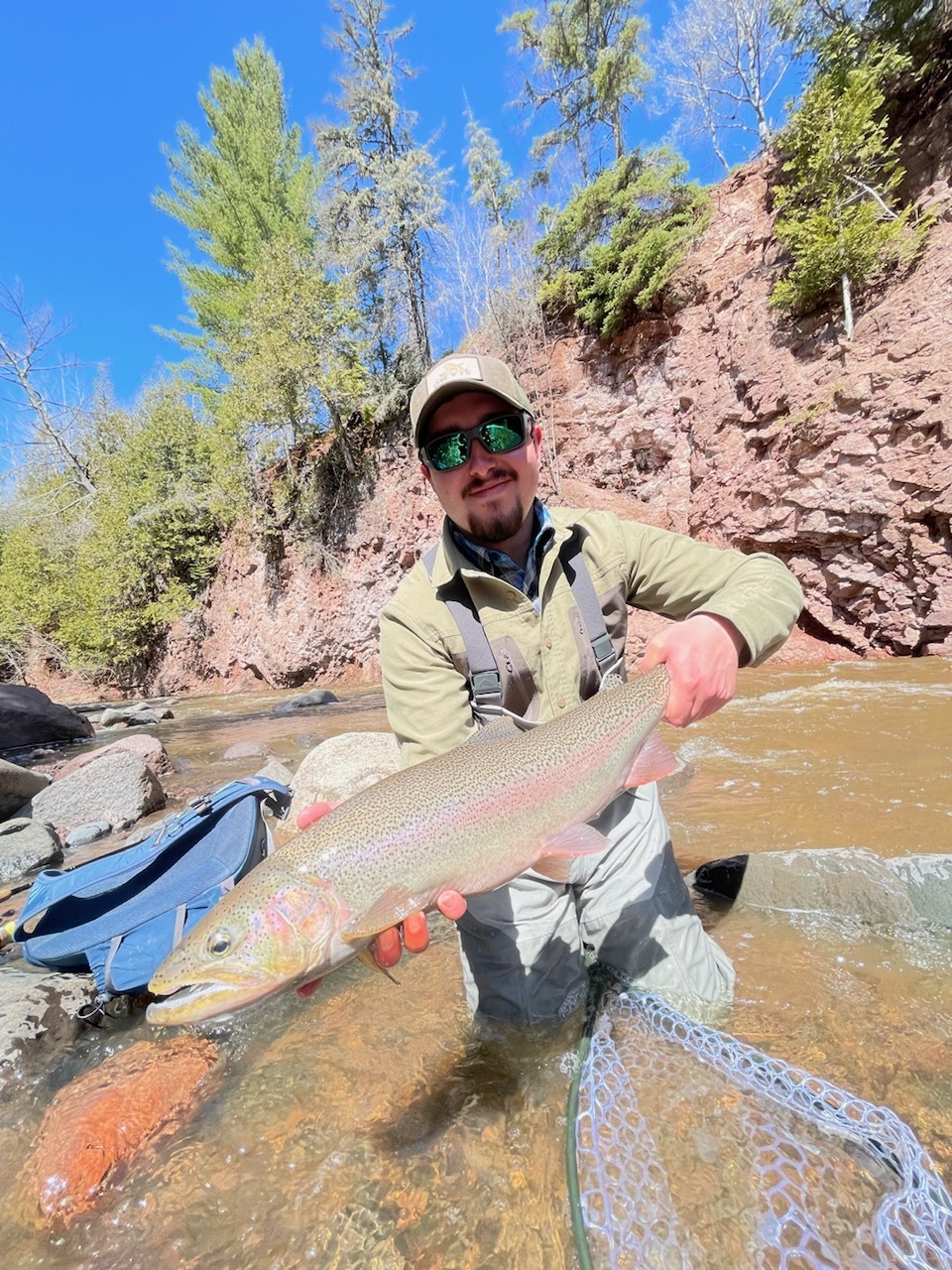 Picture of a happy angler with a North Shore steelhead Rainbow Trout