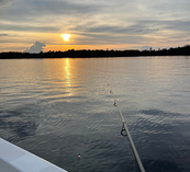 sunset with fishing pole and bobber
