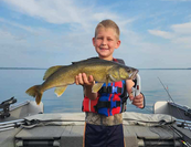 young angler with large walleye