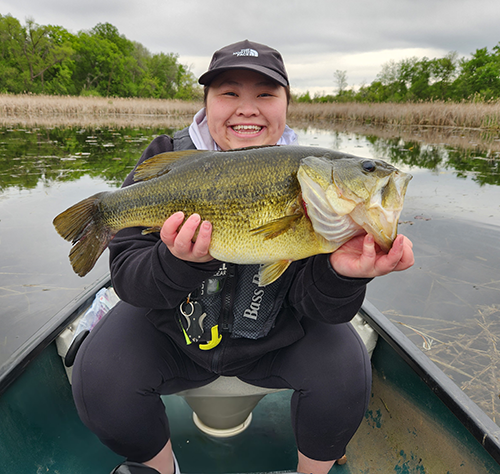 angler holding large largemouth bass