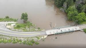 The Mississippi River encroaches on a park and bridge Thursday near Lower Grey Cloud Island in Cottage Grove, south of St. Paul.