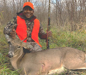hunter with deer he harvested