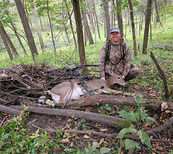 archery hunter with a doe he harvested