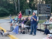 a group of people staring up at a sky