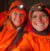 two hunters in blaze orange taking a selfie