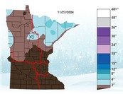 A map of Minnesota is color coded to show how much snow has fallen.