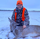 hunter with antlerless deer he harvested