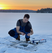 angler using a tip-up on the ice