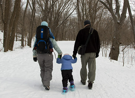 A family hiking in the snow