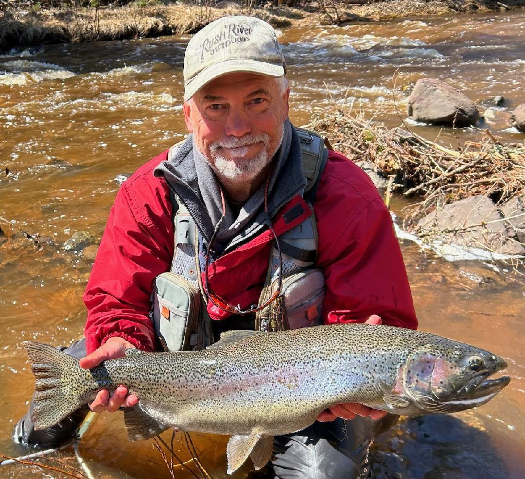 Angler with Large Steelhead Rainbow Trout