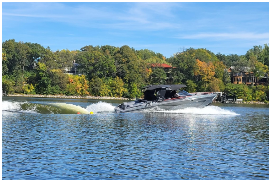 Boat with wake on lake