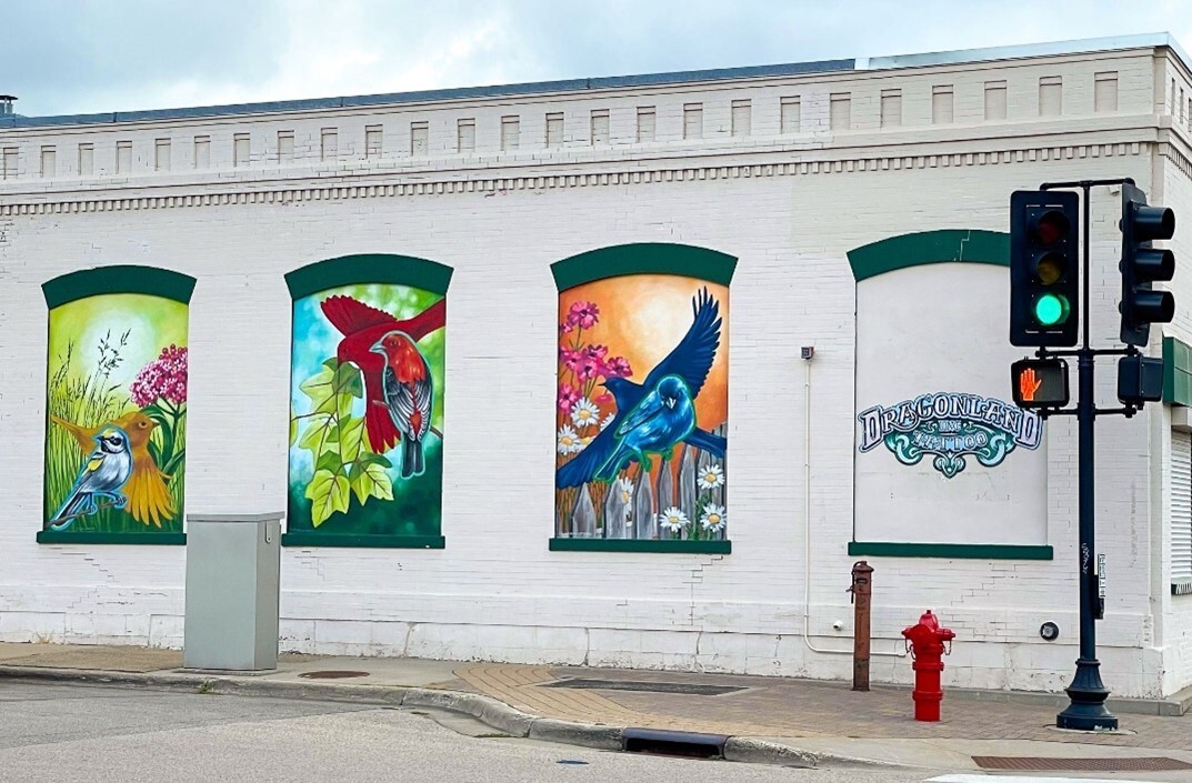 A Golden-winged Warbler, Scarlet Tanager, and Indigo Bunting mural by Kada Goalen. 