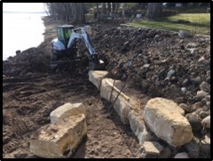 Big stone retaining wall under construction