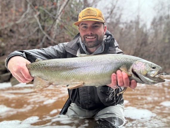Angler with a Steelhead and big smile