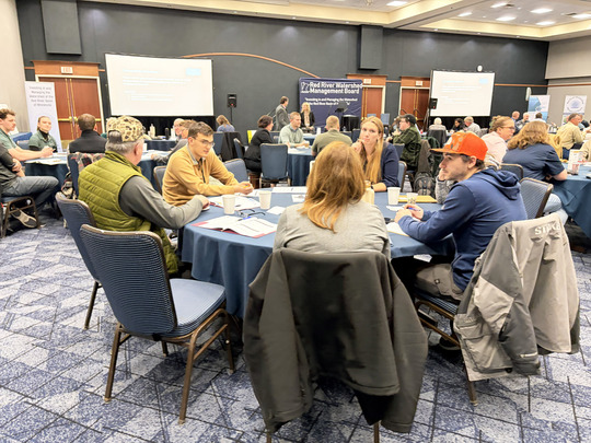 Participants in small group discussion