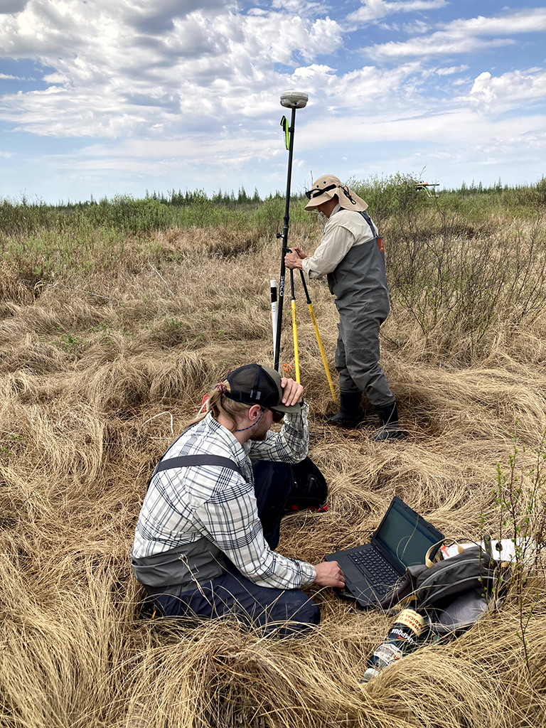 Staff collecting water and survey data