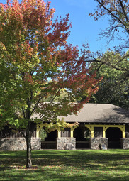 A stone picnic shelter in the fall. 