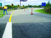 Decorative - Worker applying high friction surface treatment